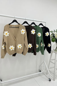 Cardigan – Cozy knit, playful floral details.