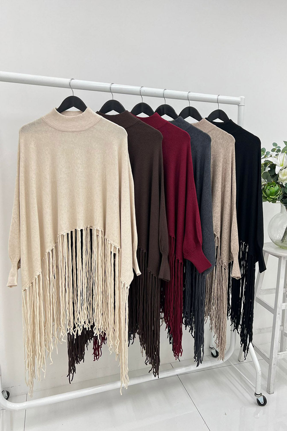 High neck Relaxed fit , fringe poncho