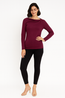 Chic asymmetric long-sleeve top with a draped neckline and gold-tone shoulder detail