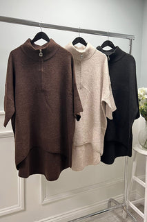 Oversized , soft woollen textured , wide sleeves jumper with half-zip collar
