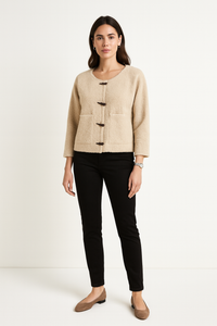 Structured short Cardigan with a round neckline, front toggle closures, and clean patch pockets