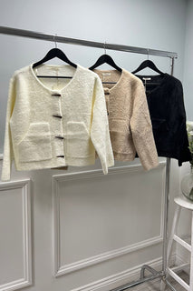 Structured short Cardigan with a round neckline, front toggle closures, and clean patch pockets