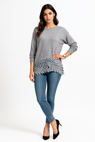 a relaxed fit jumper with a unique laser-cut leaf pattern along the hem