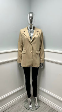 Blazer with structured shoulders and flap pockets — featuring a sleek two-button closure