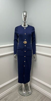 Knit dress with a sleek straight cut, gold button detailing, and statement floral belt
