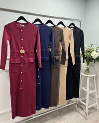 Knit dress with a sleek straight cut, gold button detailing, and statement floral belt