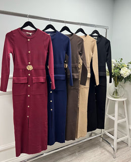 Knit dress with a sleek straight cut, gold button detailing, and statement floral belt