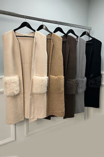 sleeveless open-front jacket with luxurious faux fur pockets