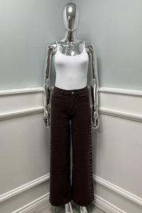 Contemporary chic — high-waist brown wide-leg jeans with side stud detailing
