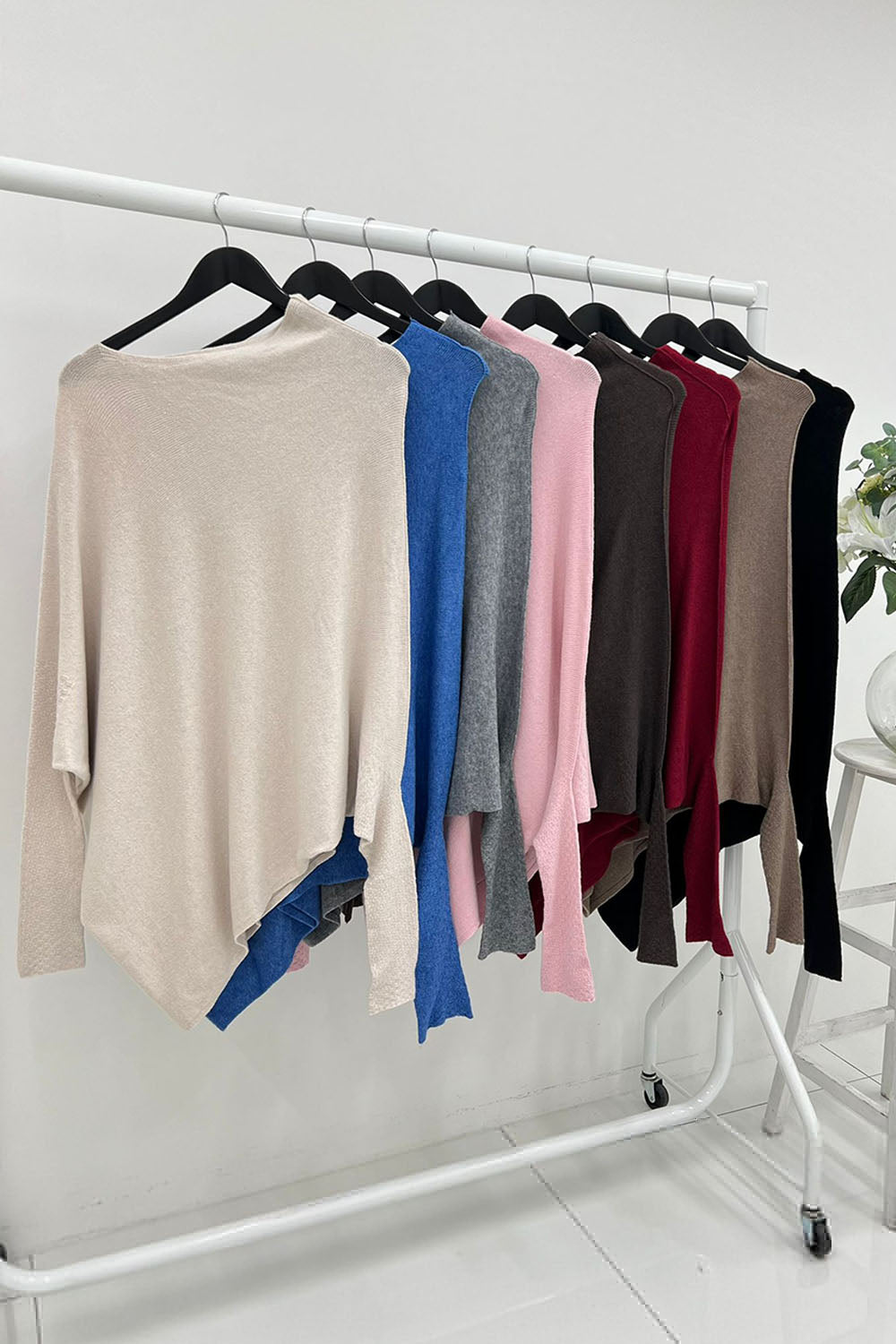 Round Neck, Asymmetric Knitted Jumper.
