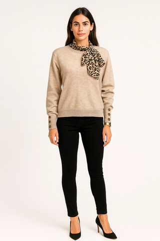 ong sleeves, ribbed hems, and a button detail Jumpers with leopard print scarf tied around the neckline