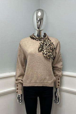 ong sleeves, ribbed hems, and a button detail Jumpers with leopard print scarf tied around the neckline