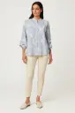 Relaxed, flowy silhouette Shirt with button-down front and subtle mandarin-style collar